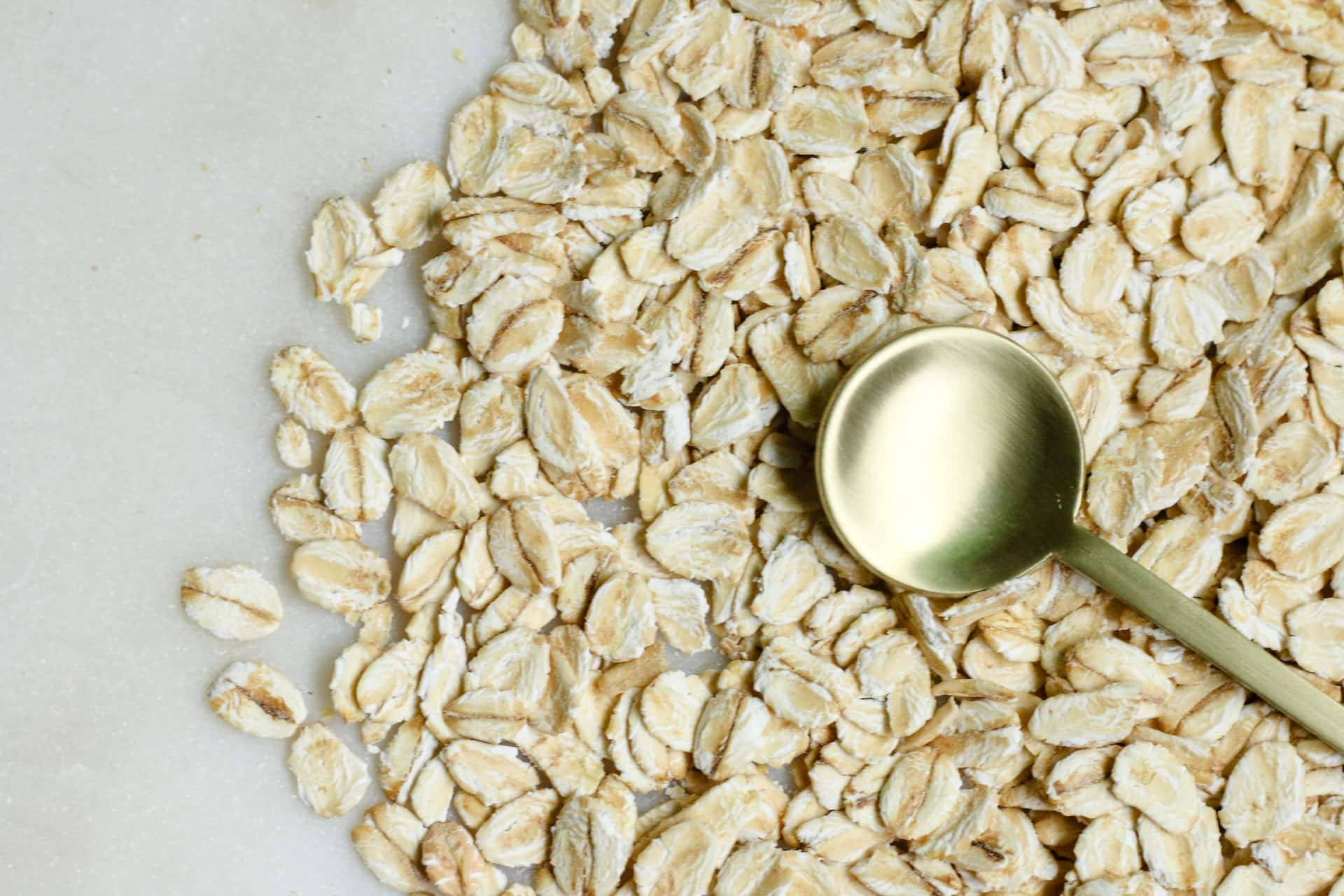 A-bunch-of-oats-with-a-golden-spoon-healthy-flour