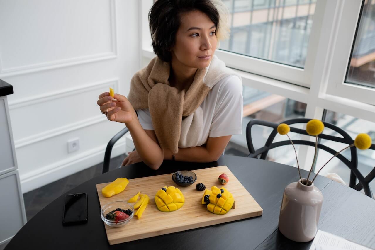 woman eating mango