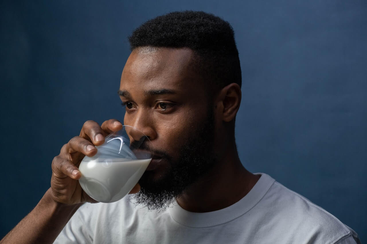 man-drinking-glass-of-milk