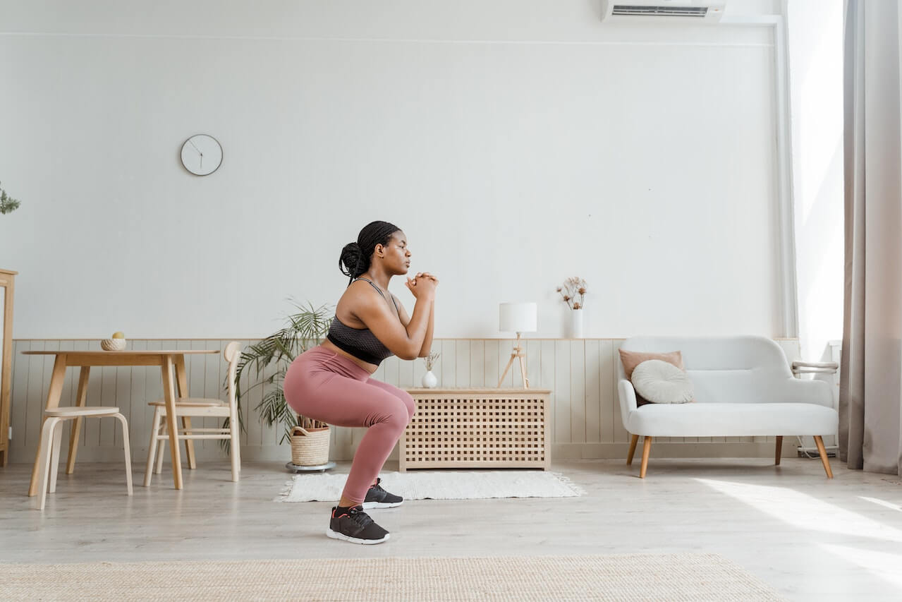 woman-doing-squats-at-home-hiit-workout