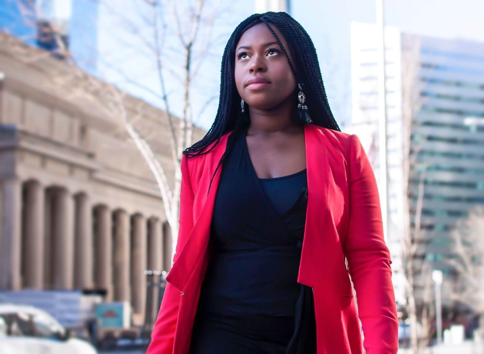 Woman dressed in business clothes taking a walk in a city