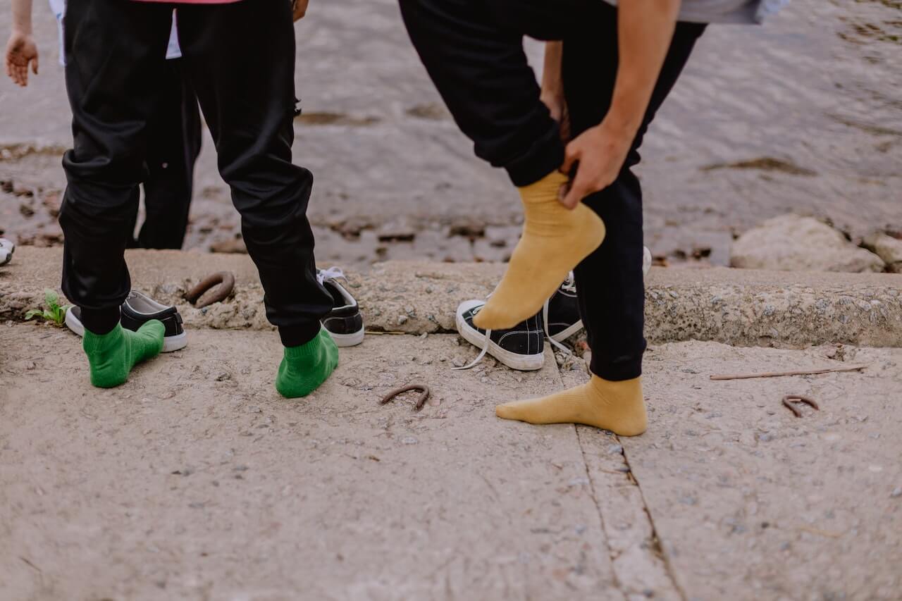 two-guys-with-socks-suffering-from-swollen-feet