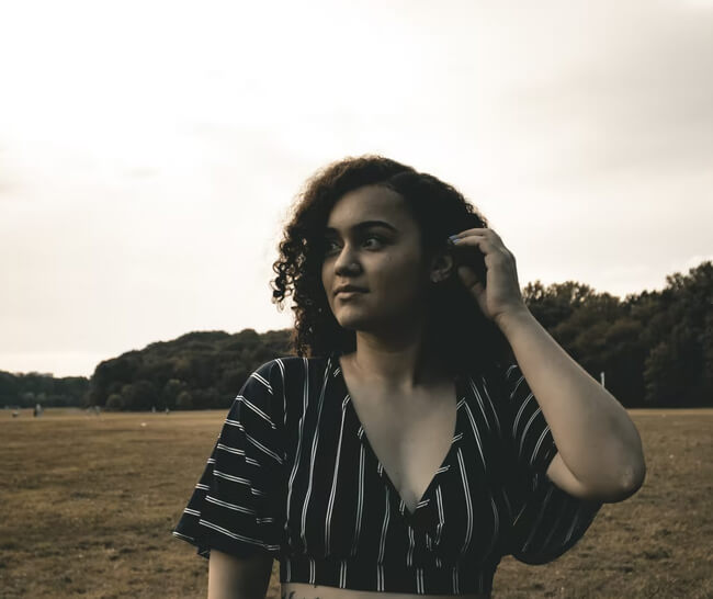 Woman standing outside during a nature walk