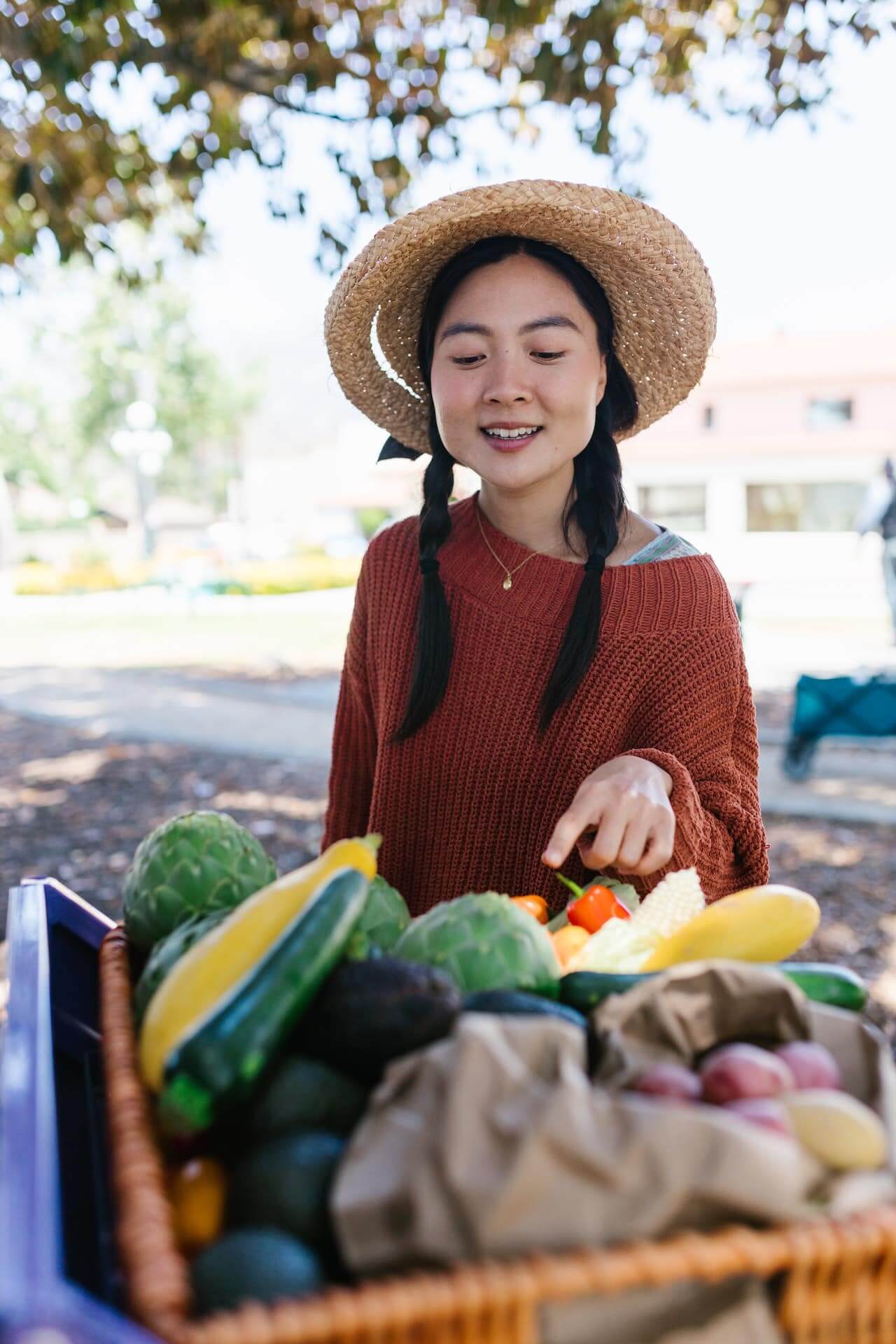 Woman-in-Brown-Knitted-Sweater-Picking-Vegetables