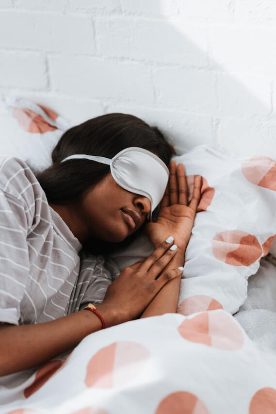 woman-sleeping-in-bed-with-eye-mask