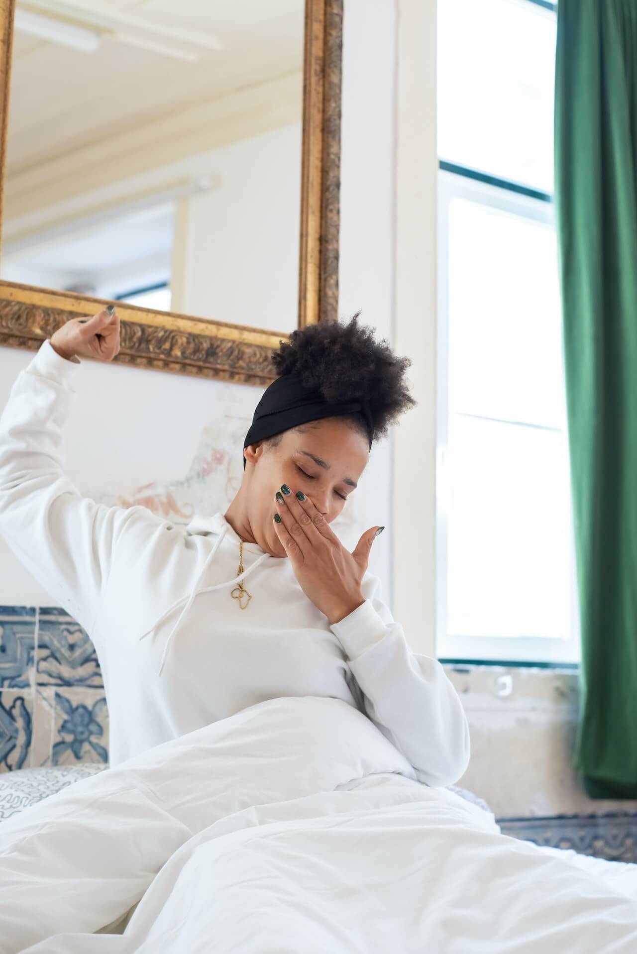 Woman-in-White-Long-Sleeve-Shirt-Yawning