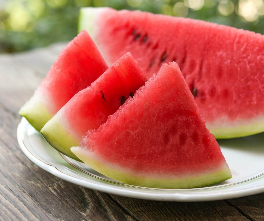 slices of watermelon on a table outdoors