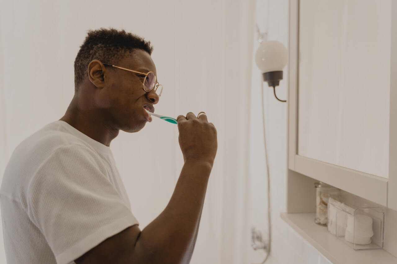 man-brushing-his-teeth-at-home