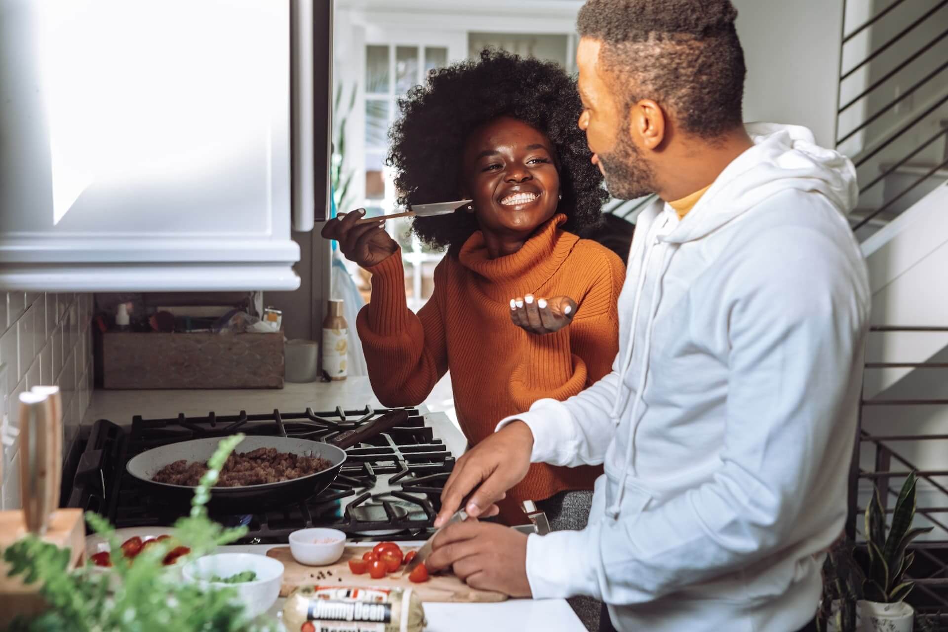 Young-black-couple-happily-preparing-a-meal-together-how-to-eat-slower