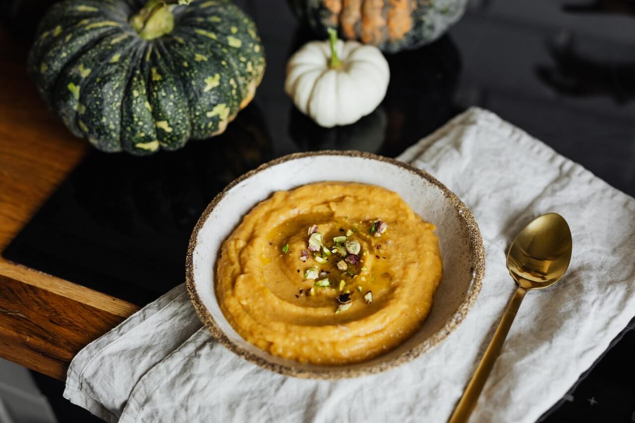 bowl-of-pumpkin-soup-in-kitchen-table