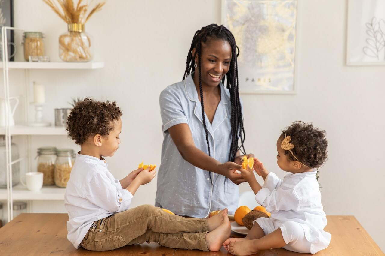 Woman-Giving-Fruits-to-her-Children