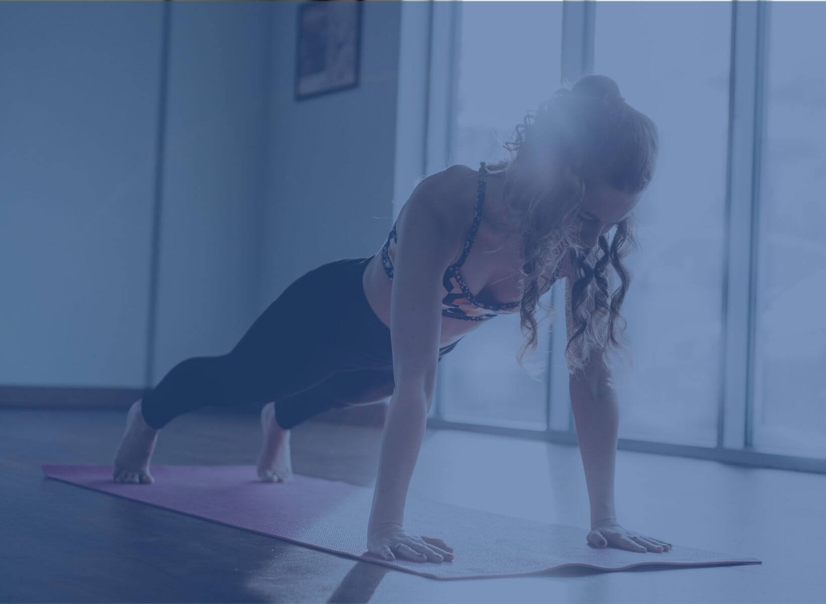 woman doing a plank as part of a full body workout