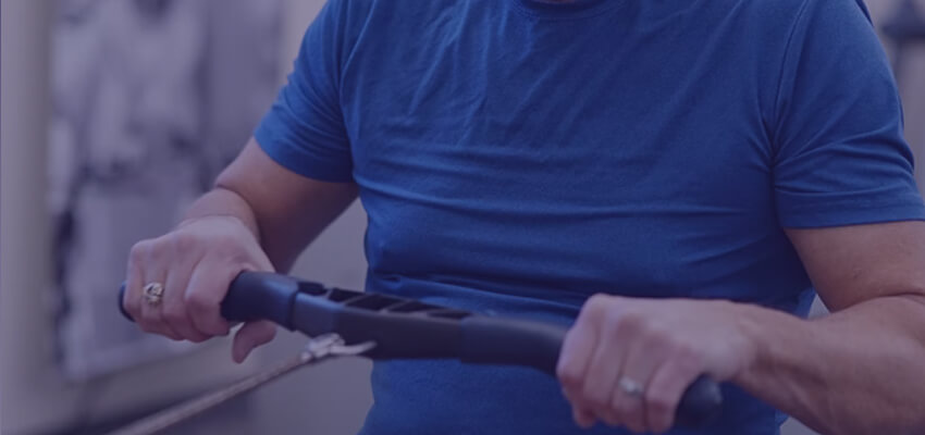 Man using the rowing machine at a gym