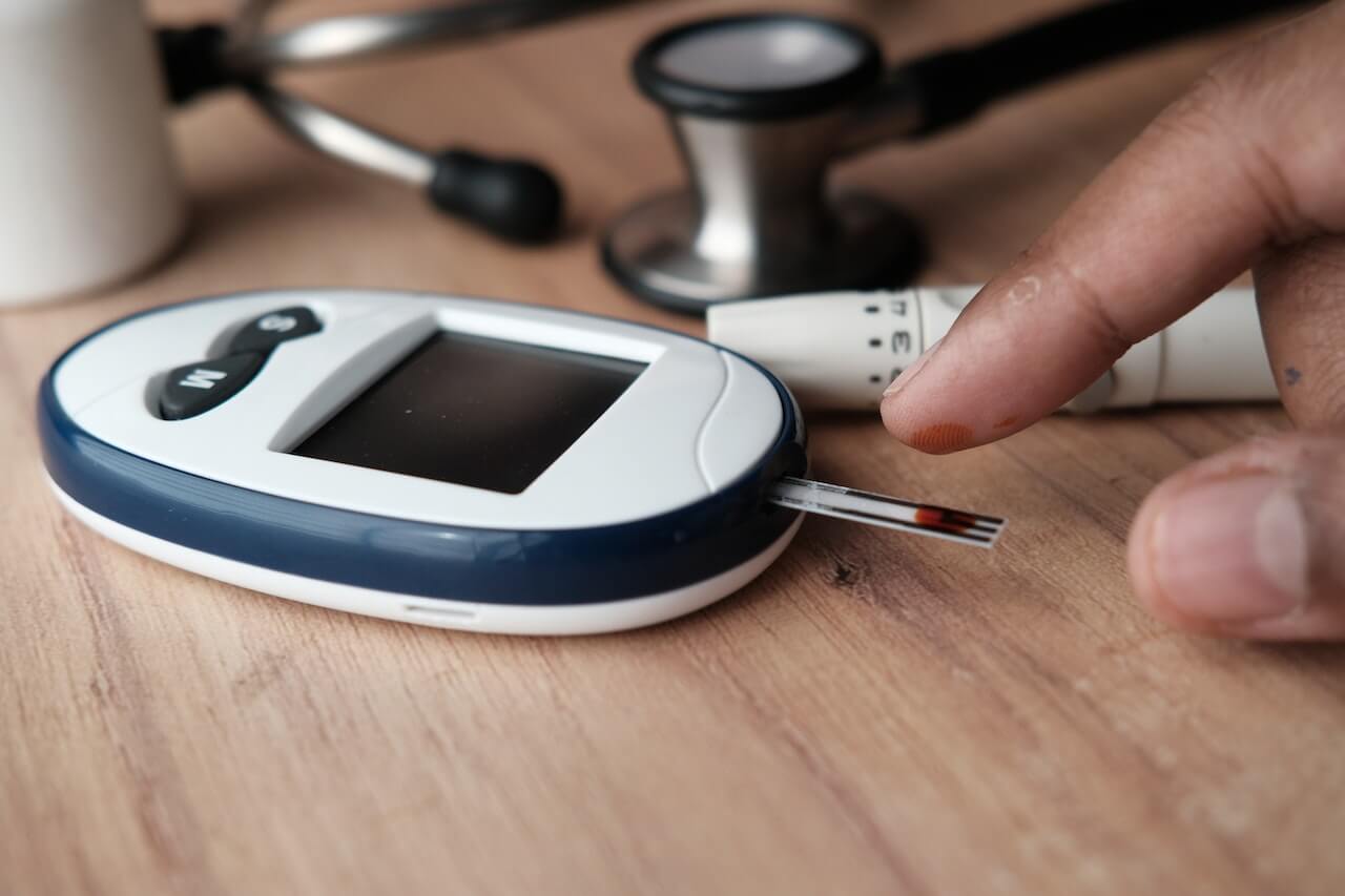 close-up-of-finger-with-drop-of-blood-on-glucometer