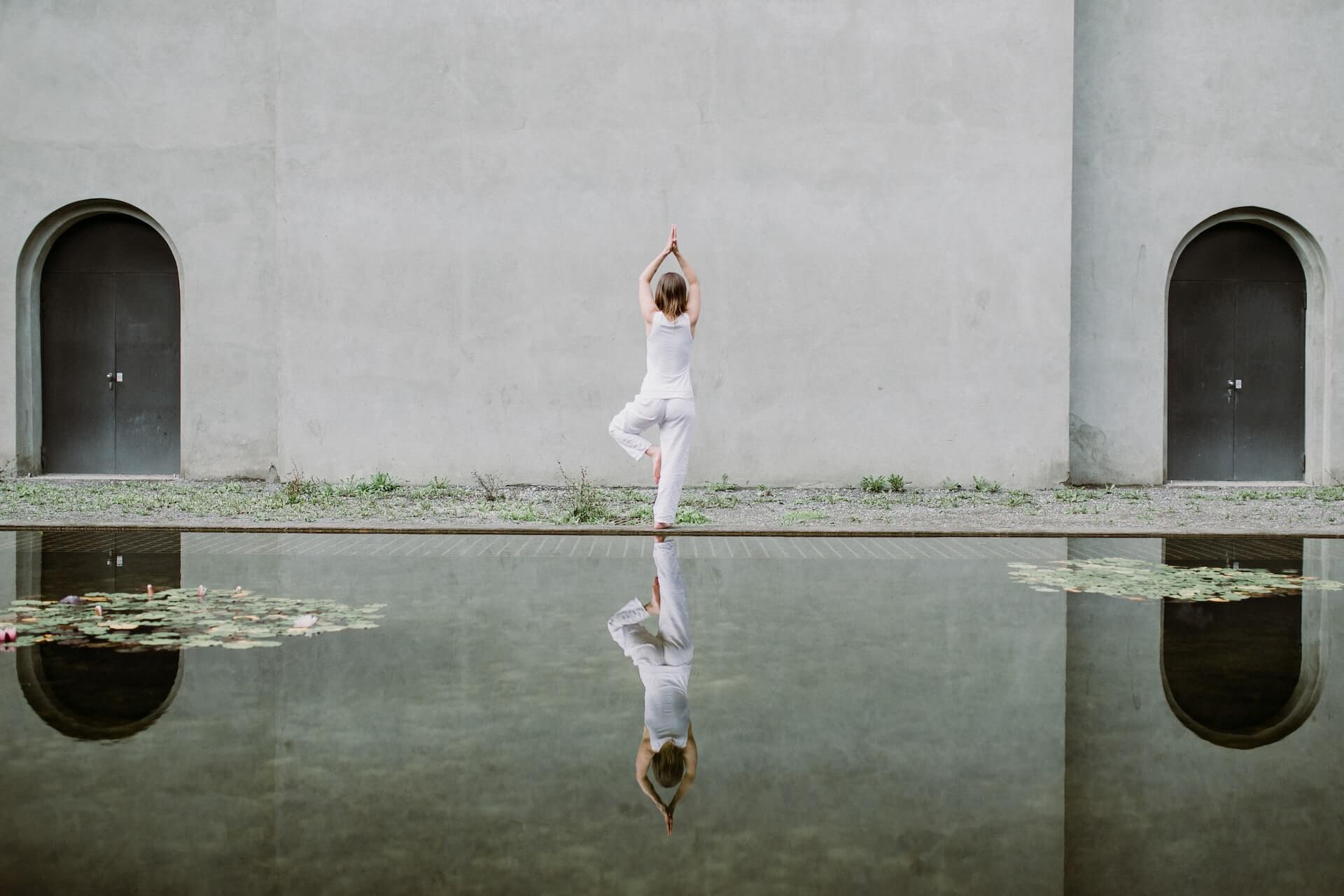 Woman-striking-a-yoga-pose-over-a-peaceful-background-yoga-for-weight-loss