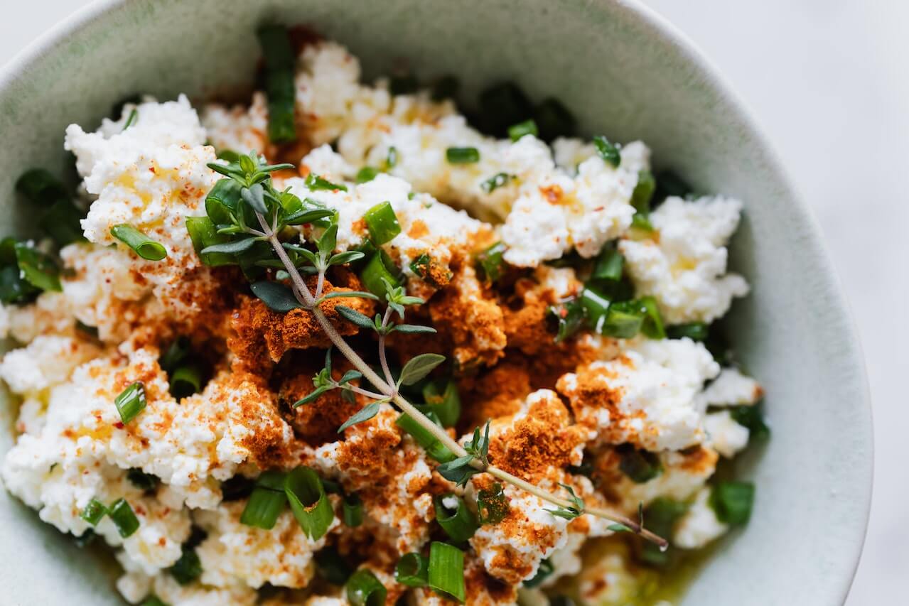 greens-with-cottage-cheese-and-paprika-on-bowl