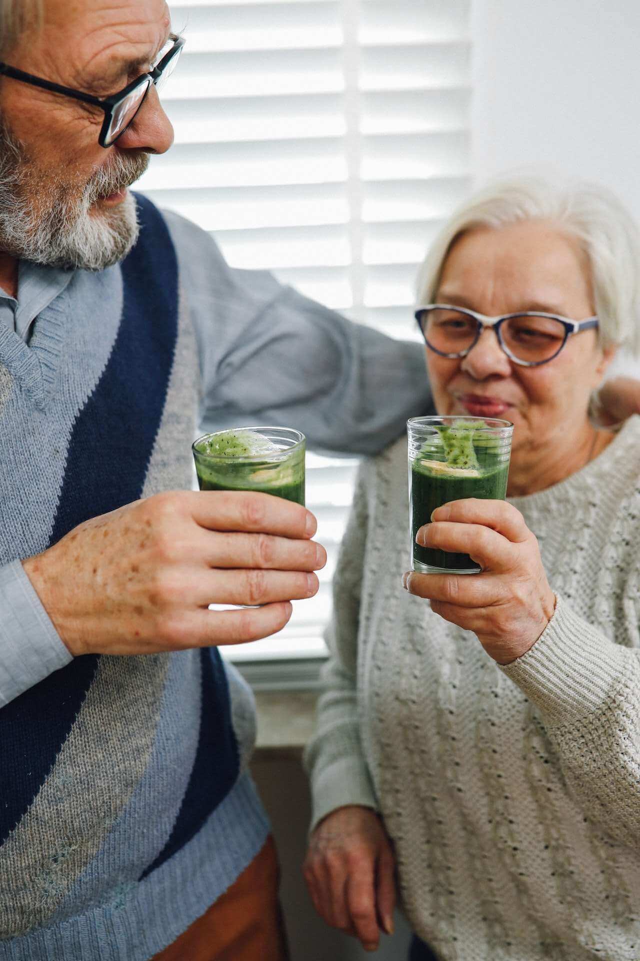 older-couple-drinking-microgreens-smoothie