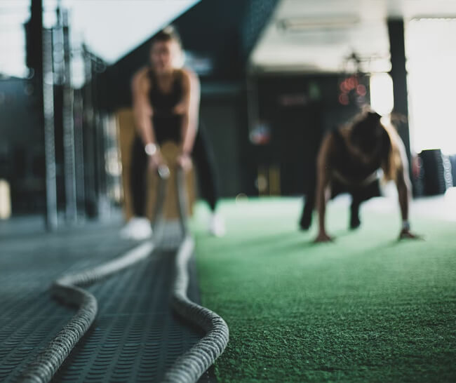 Women working out in a gym; slightly out of focus