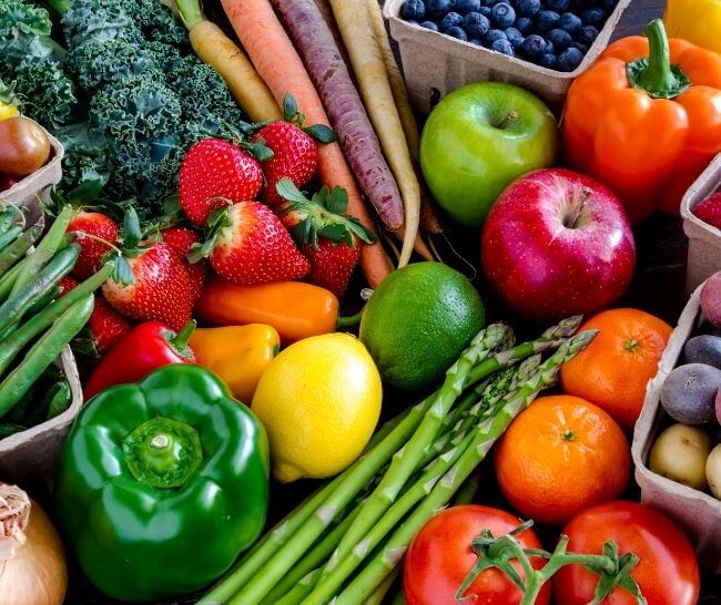 Various fruits and vegetables displayed on a table