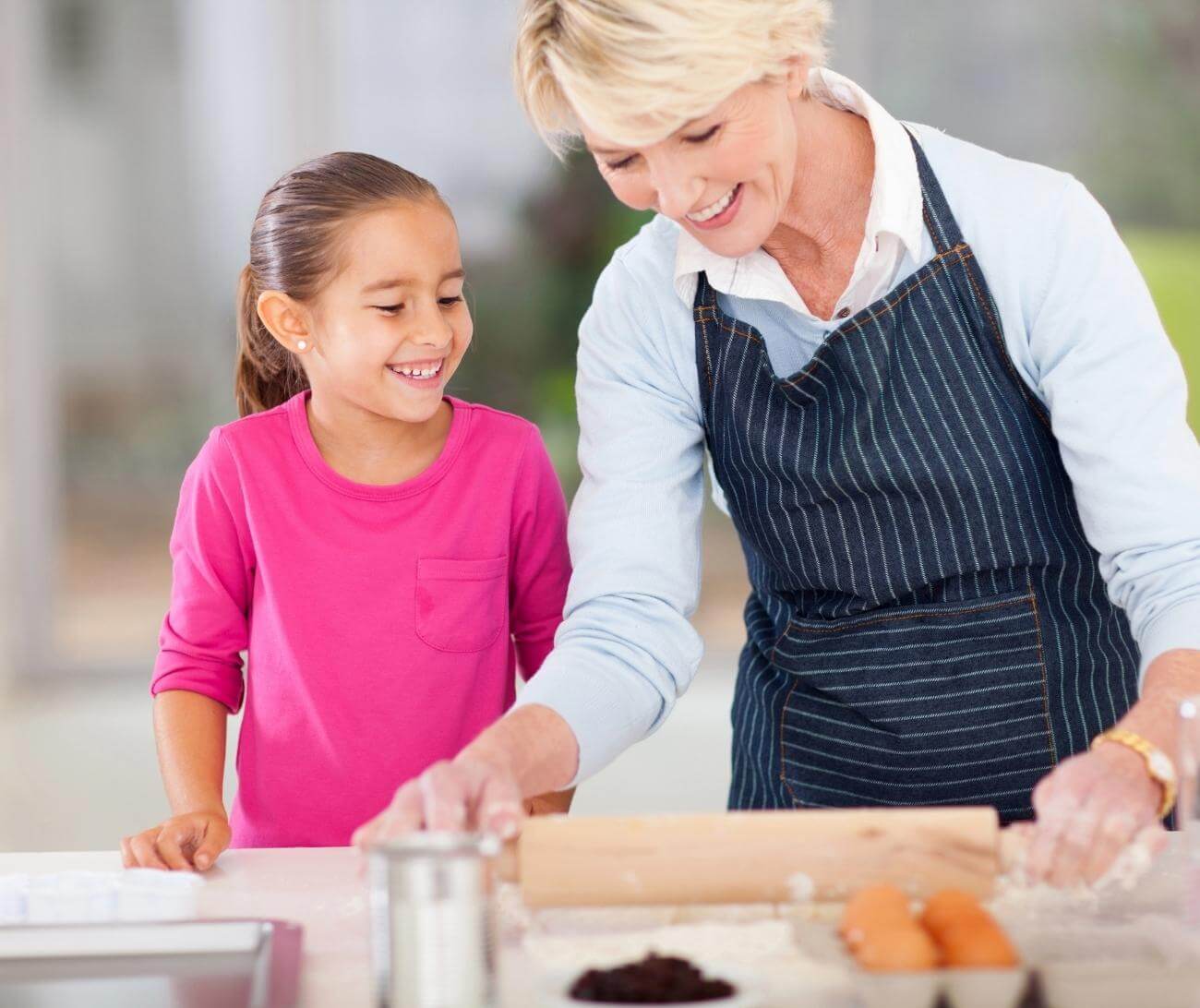 Grand mother baking with her granddaughter