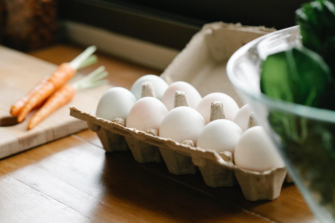 Egg-carton-on-top-of-cooking-table-with-10-eggs