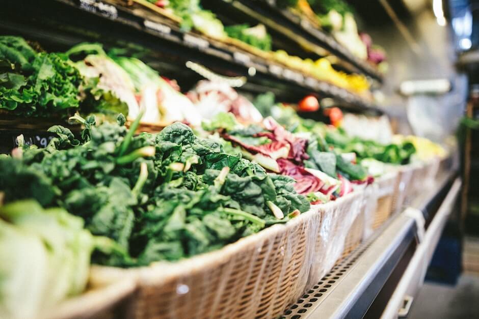 Leafy green vegetables in the produce section of a grocery store