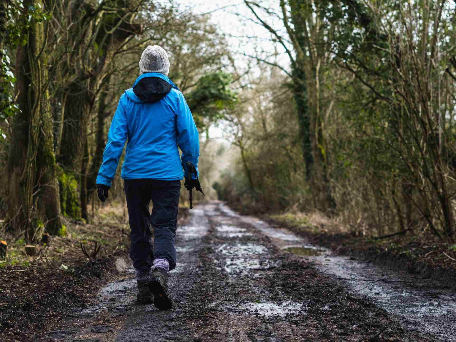 Person walking in a muddy road