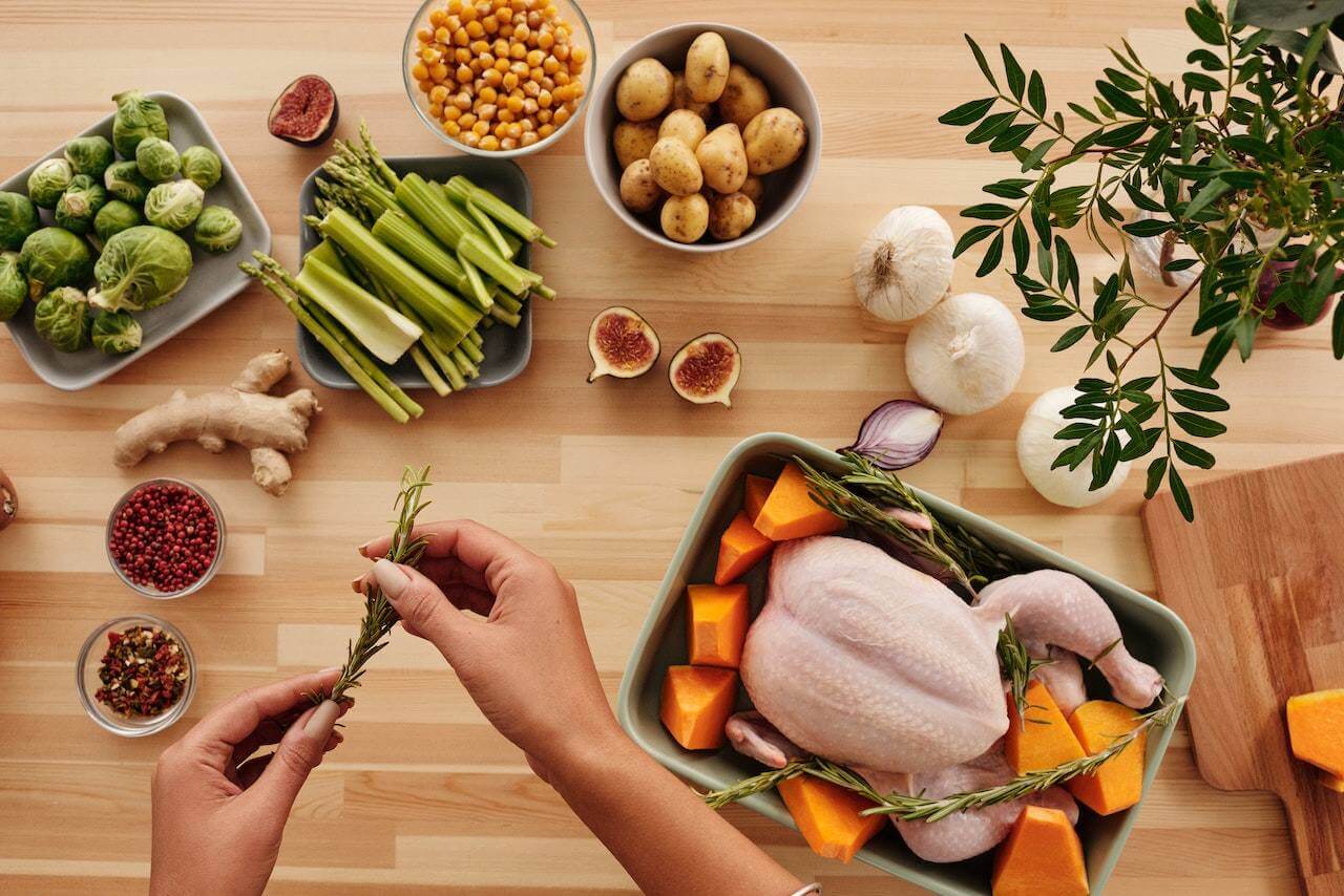 Chicken-vegetables-ginger-and-rosemary-on-kitchen-counter