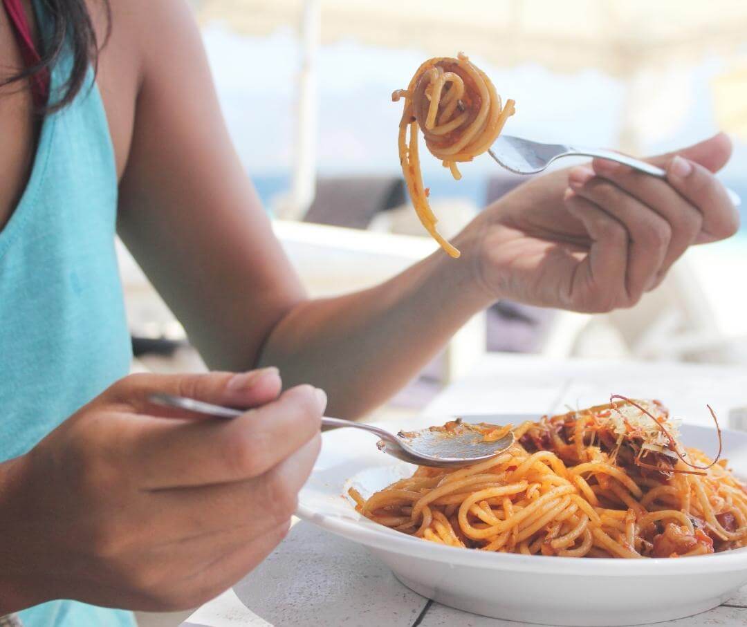 woman-eating-a-plate-of-pasta