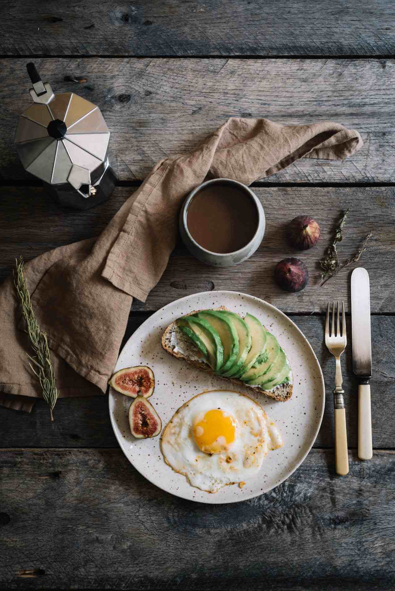 Avocado-toast-with-eggs-fruit-and-coffee