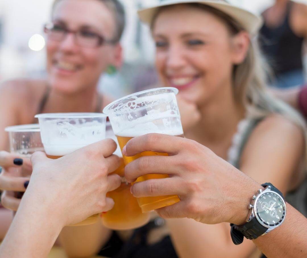 people drinking beer outdoors in summer