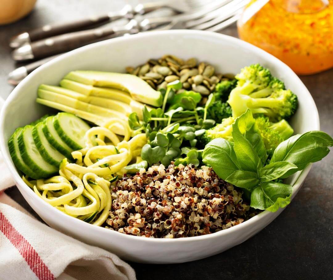 bowl of quinoa with avocado and vegetables