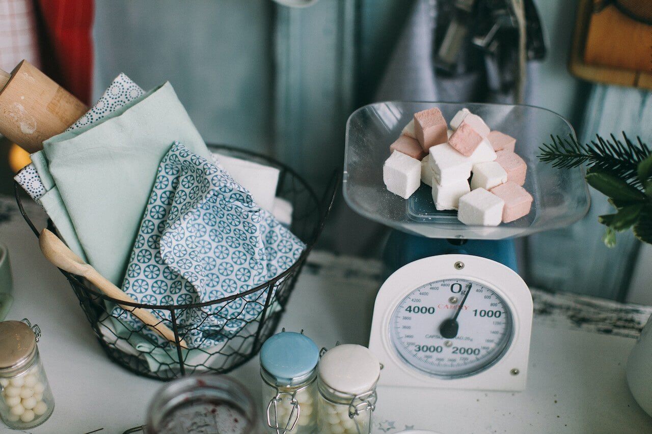 Sugar-cubes-on-weight-scale-on-kitchen