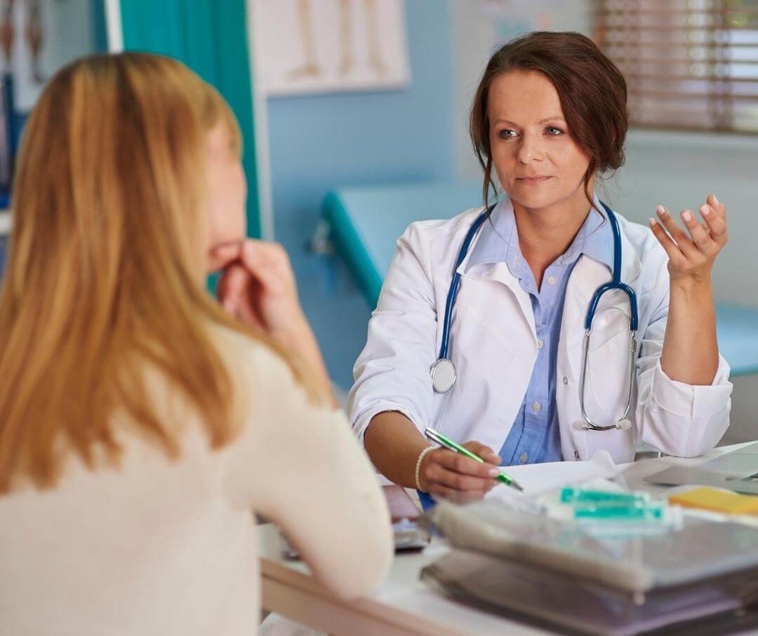 female patient consulting with doctor