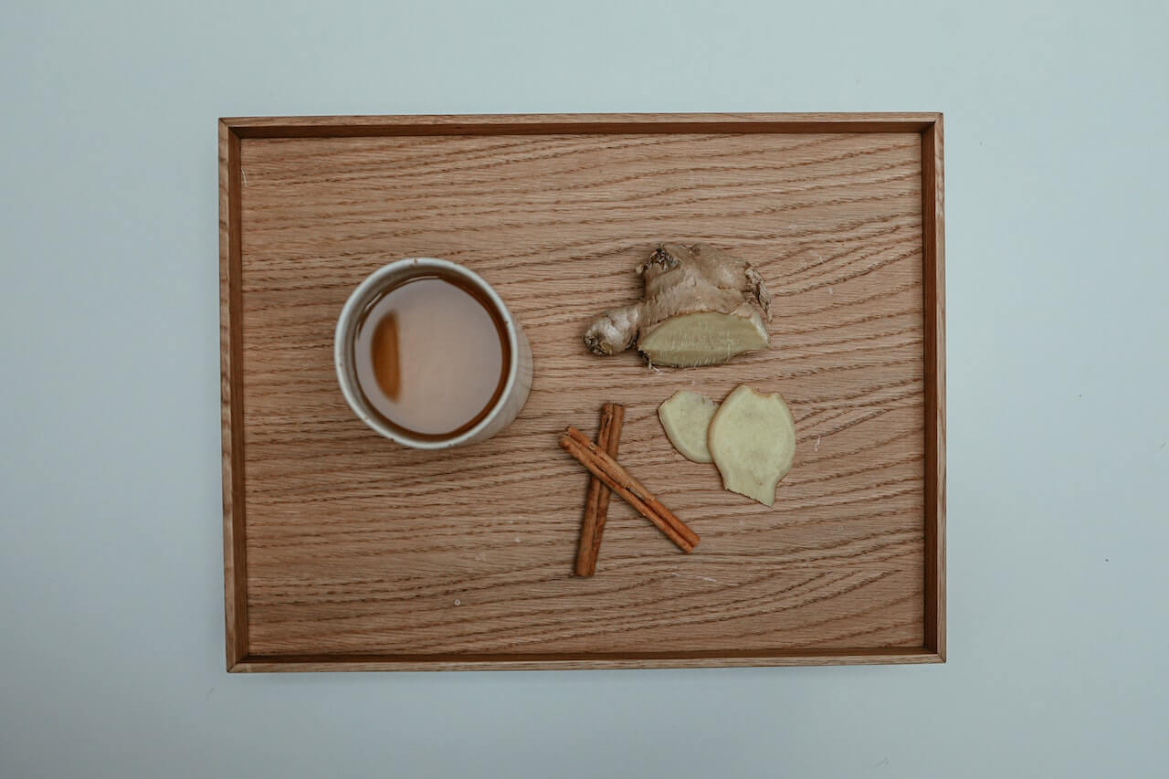 little brown table with ginger tea on top of it