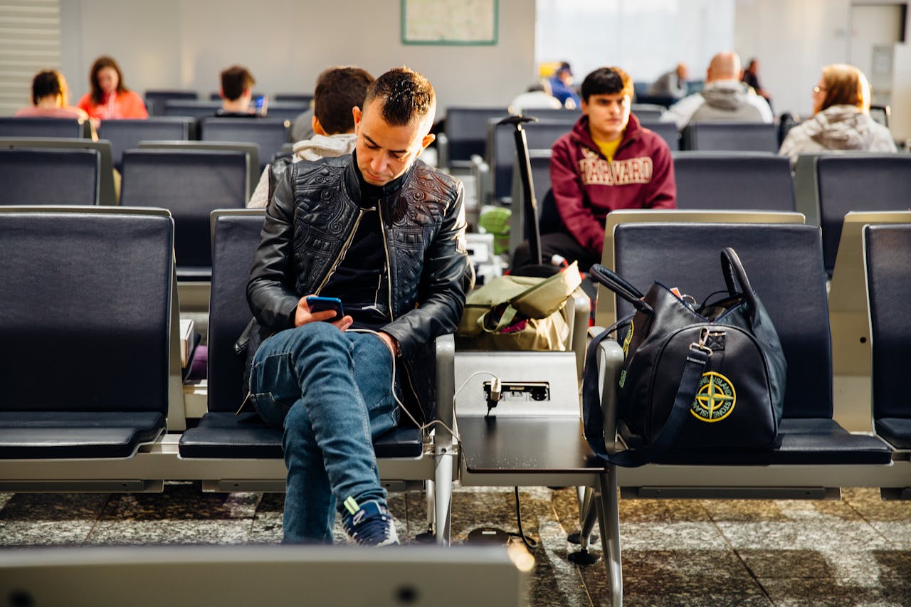 man-sitting-in-airport-lobby